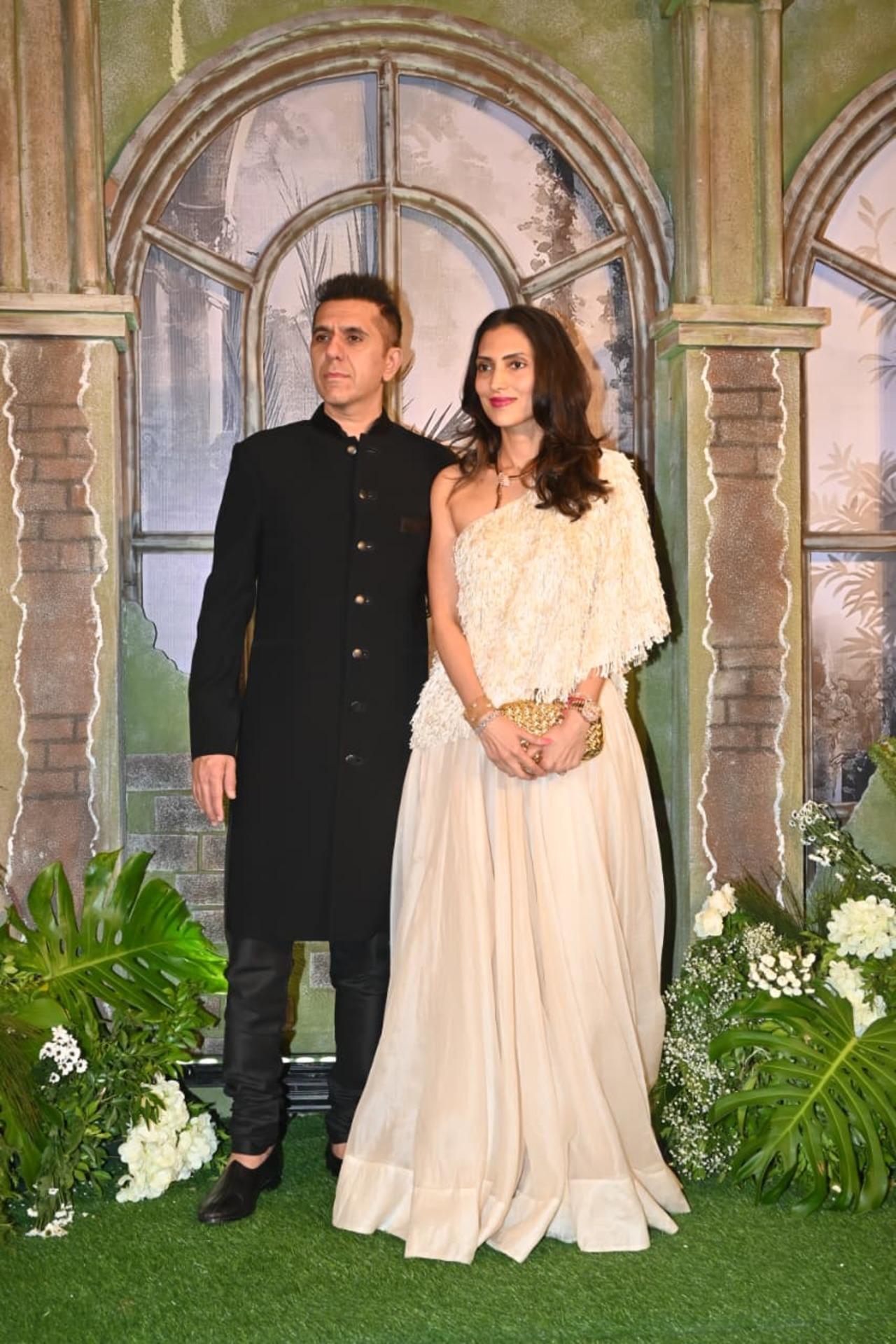 Producer Ritesh Sidhwani was seen arriving in a black sherwani with wife, Dolly Sindhwani, who wore a white one-shoulder flowy gown.